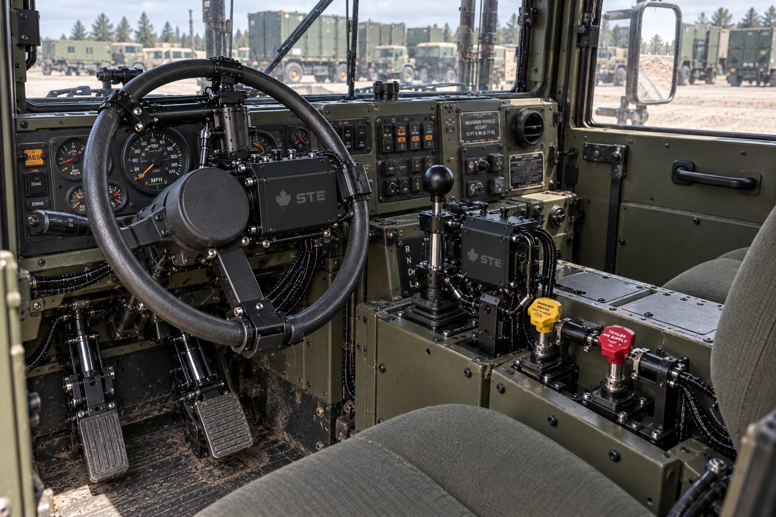 A truck's cab with kit fitted on the wheel, the pedals and the shifter